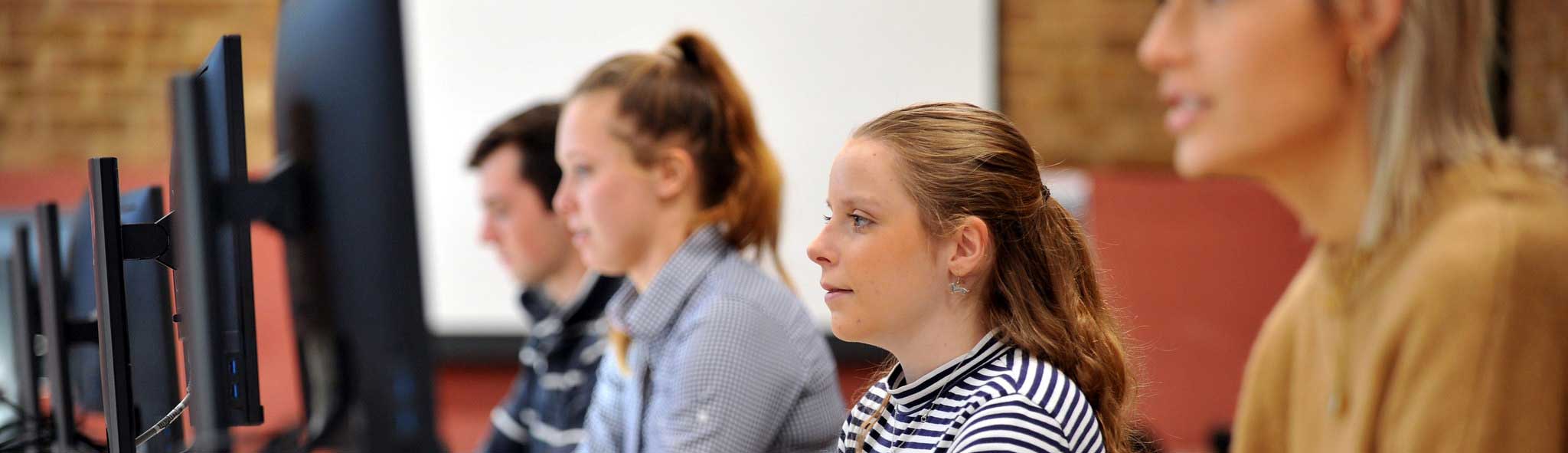 Students looking at computers