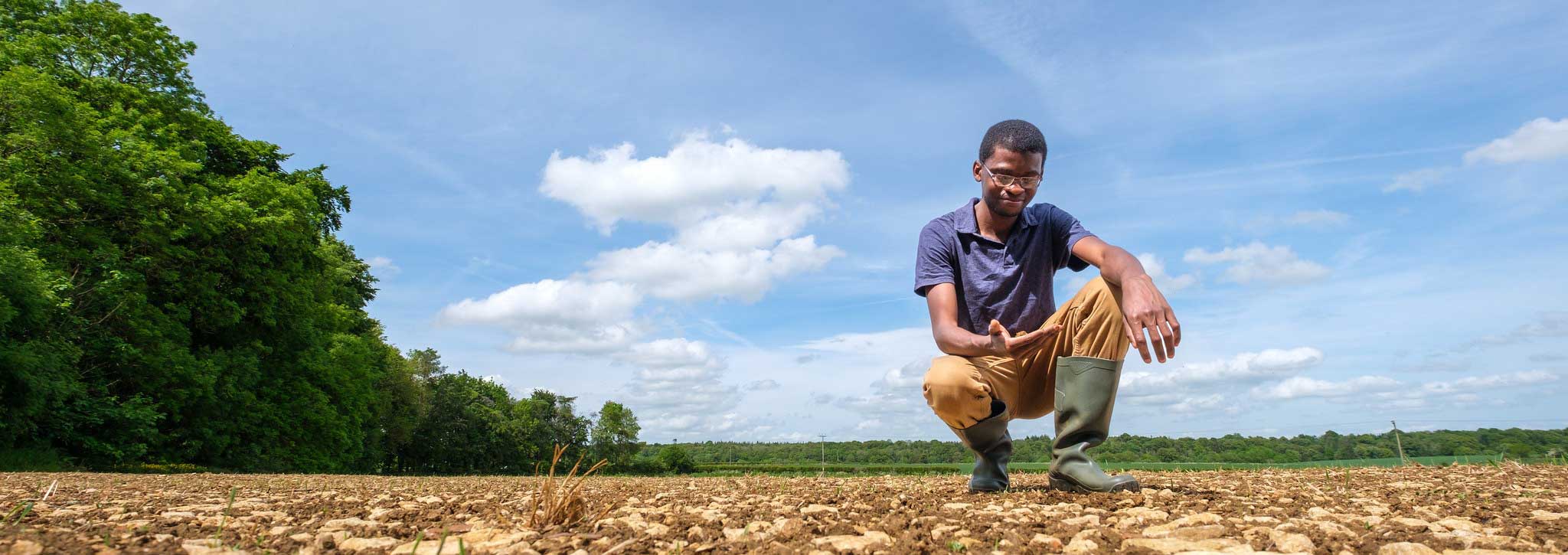 Student examining soil
