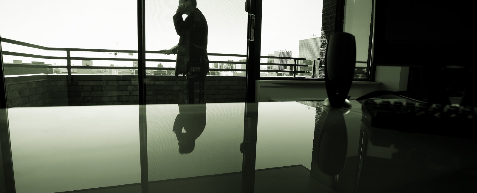 Man on phone outside meeting room