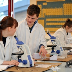 Students in lab using microscopes
