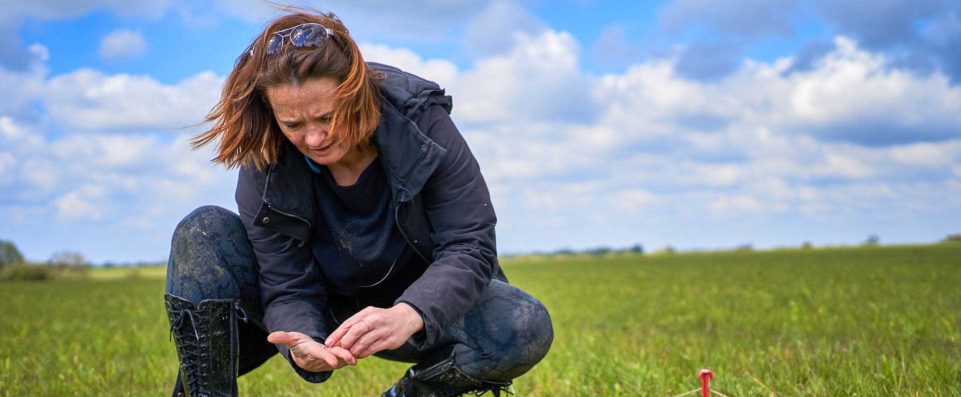 Student looking at soil