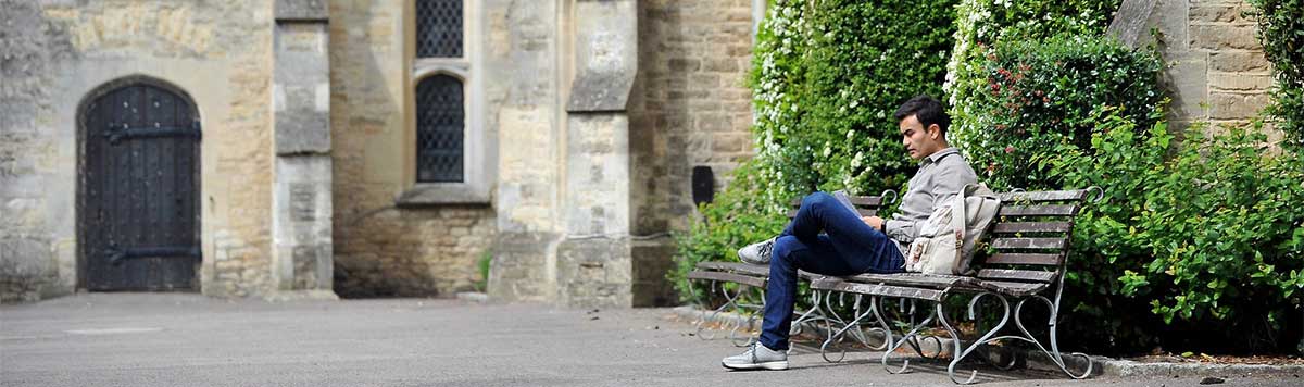 Student sitting on bench