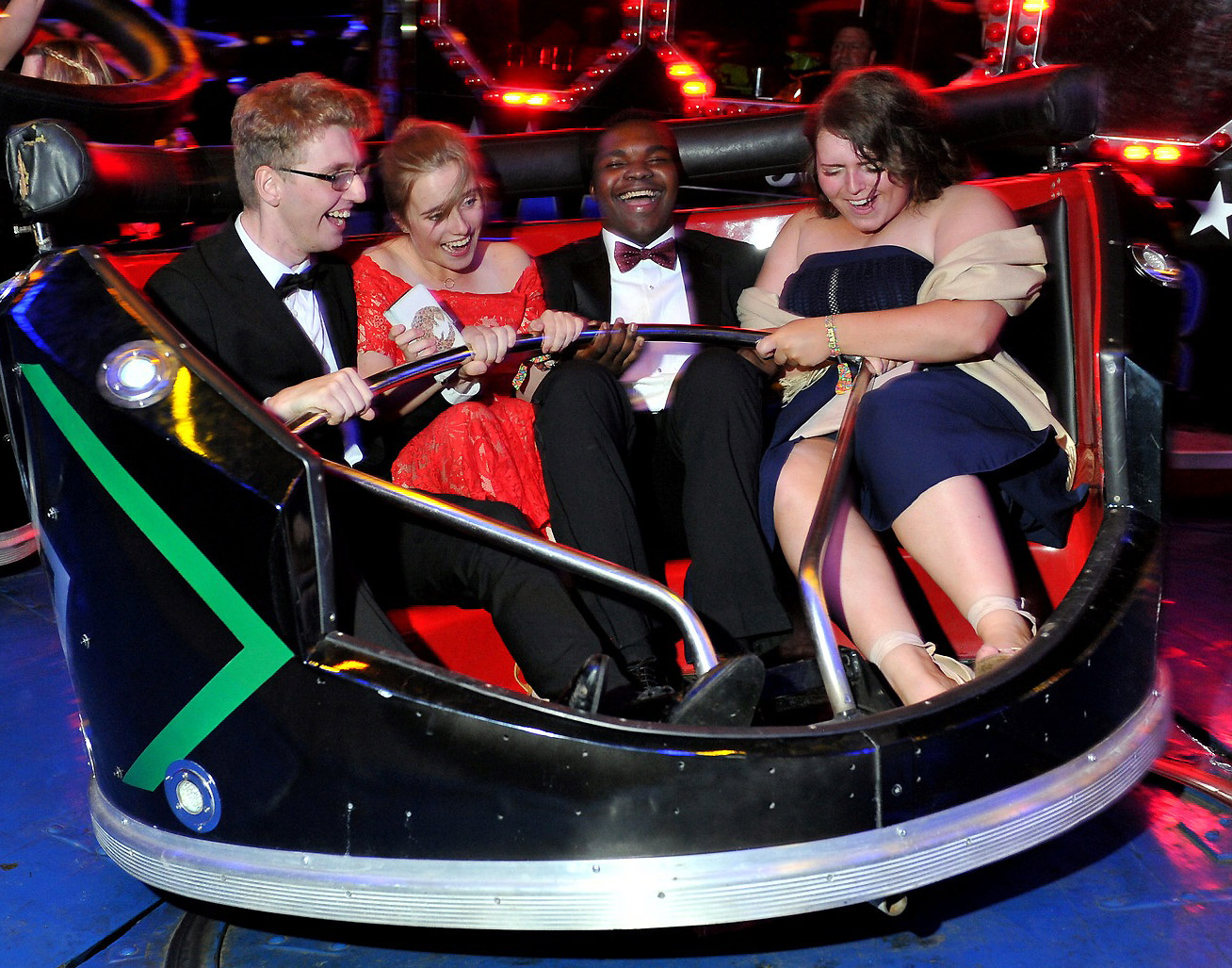 Students on Waltzers fairground ride at summer ball