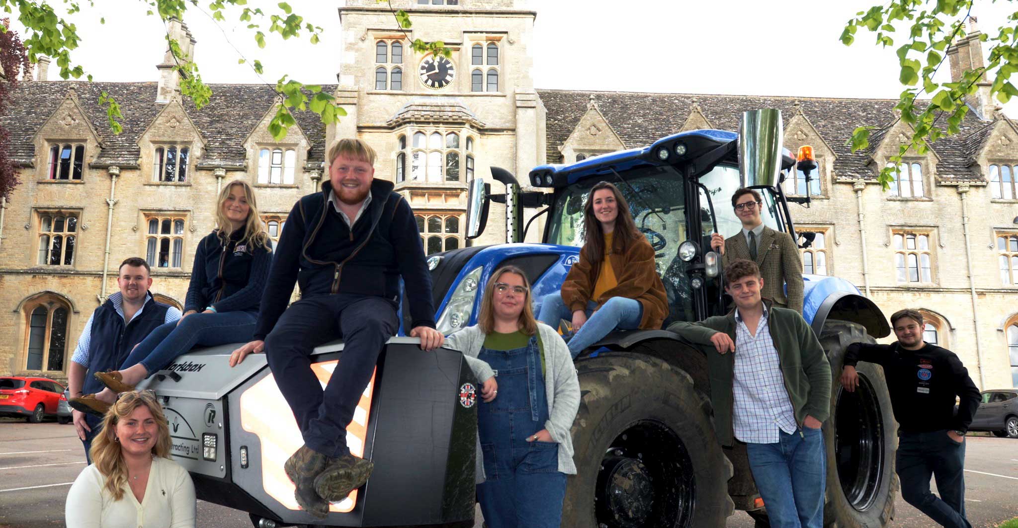Kaleb Cooper and RAU students on a tractor