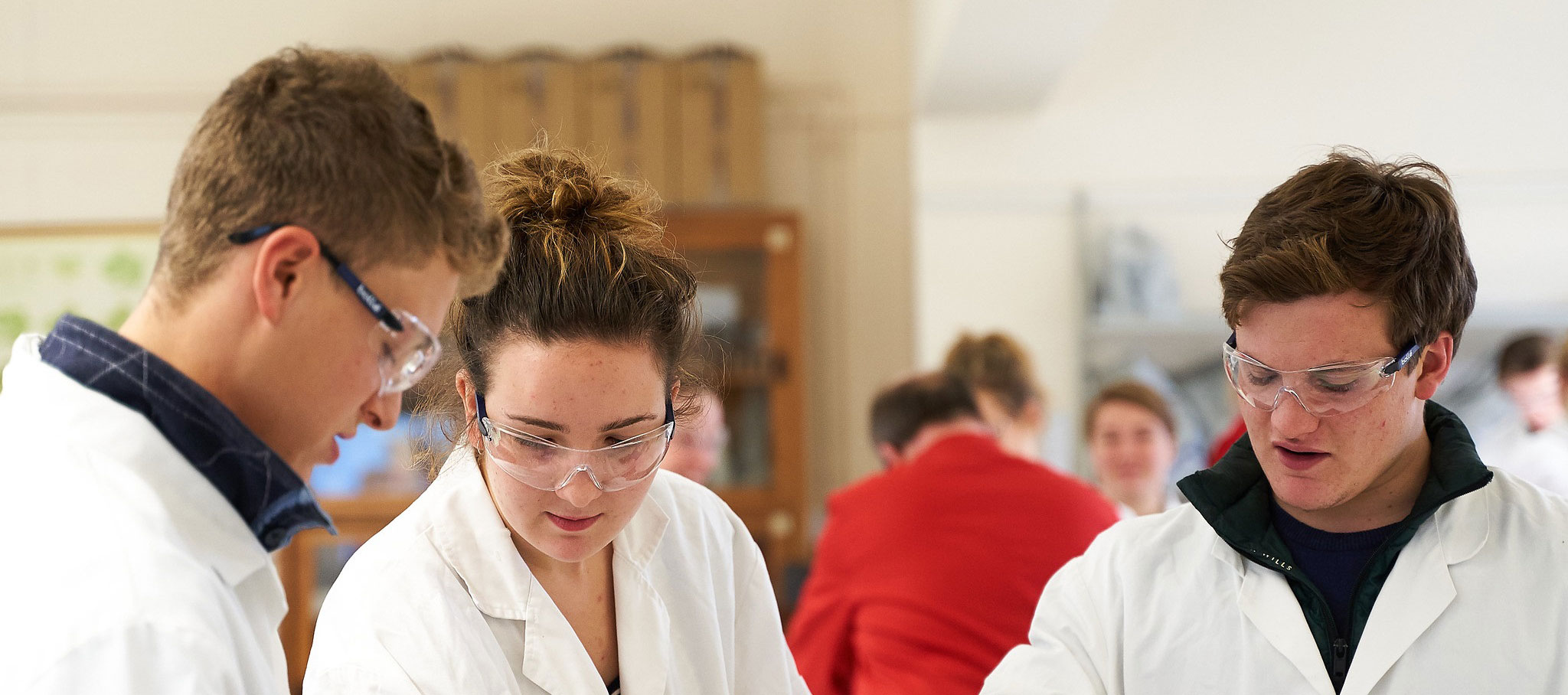 Three students in a laboratory