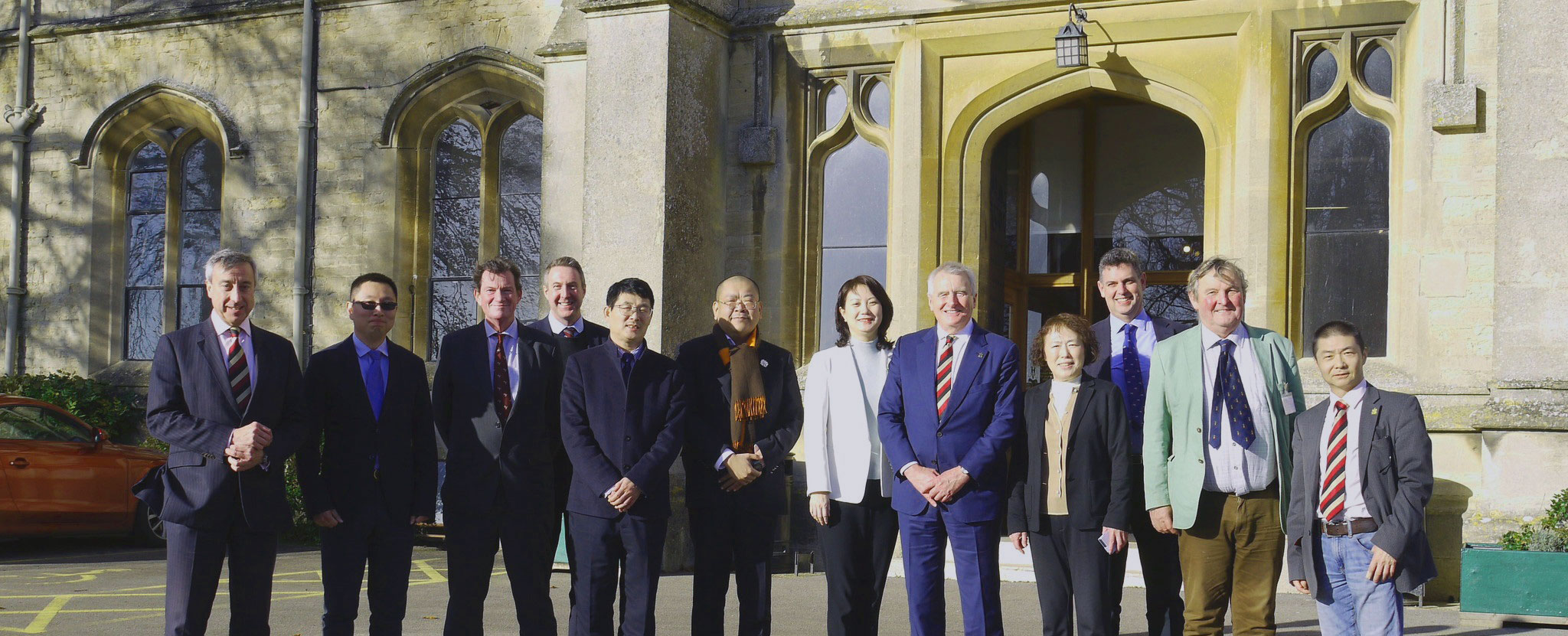Delegation from Shenyang University standing in front of entrance