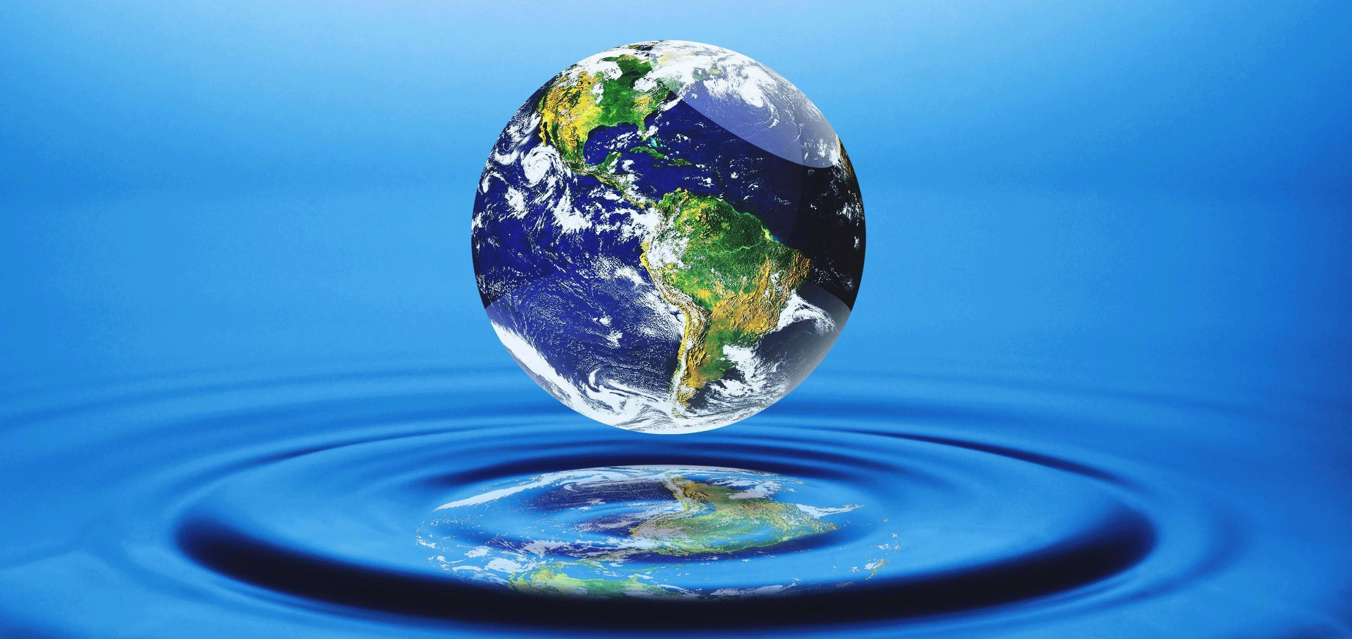 Earth reflected in water droplet