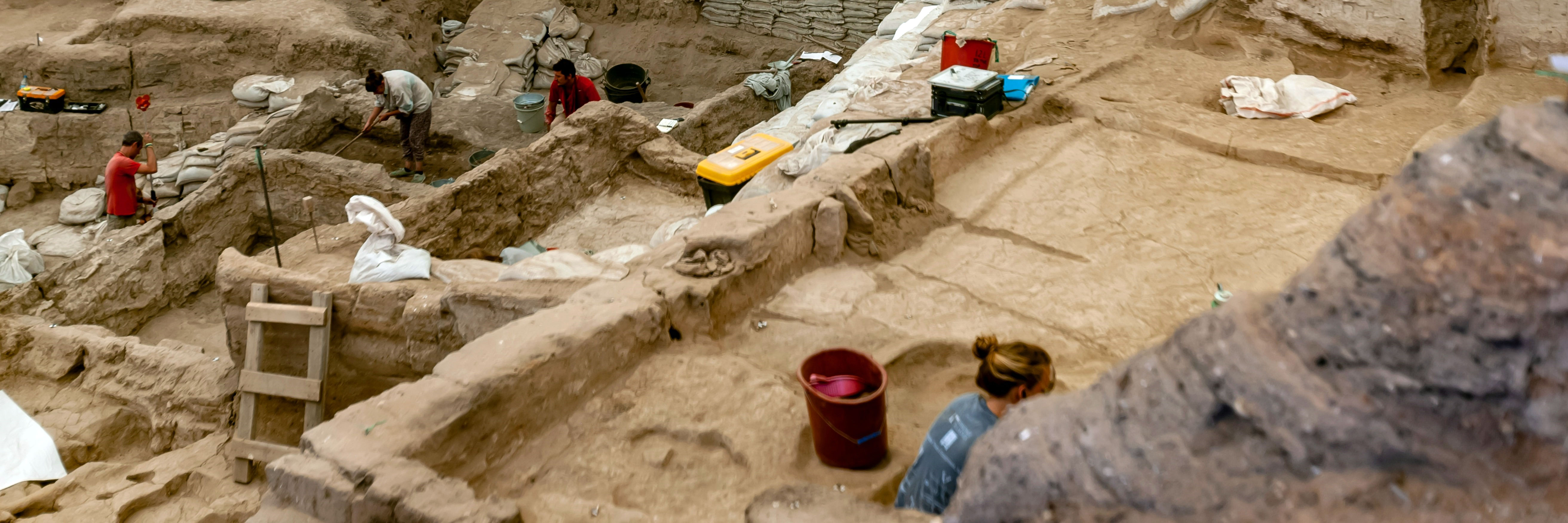 people operating an archaeological dig