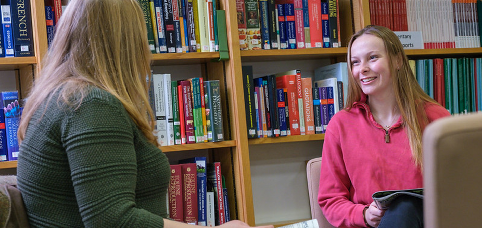 Two students in a library
