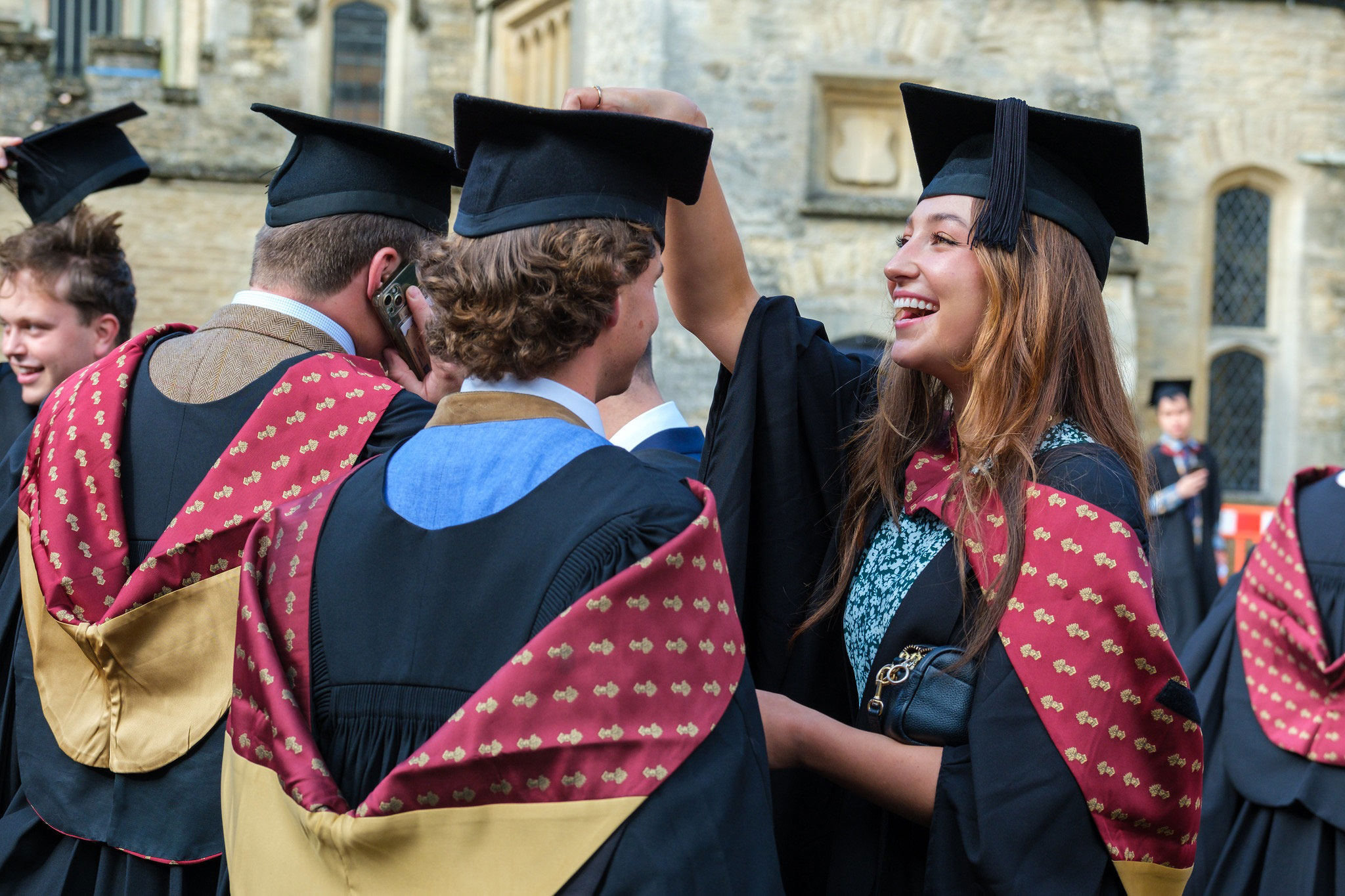 Students at graduation with gowns and hats
