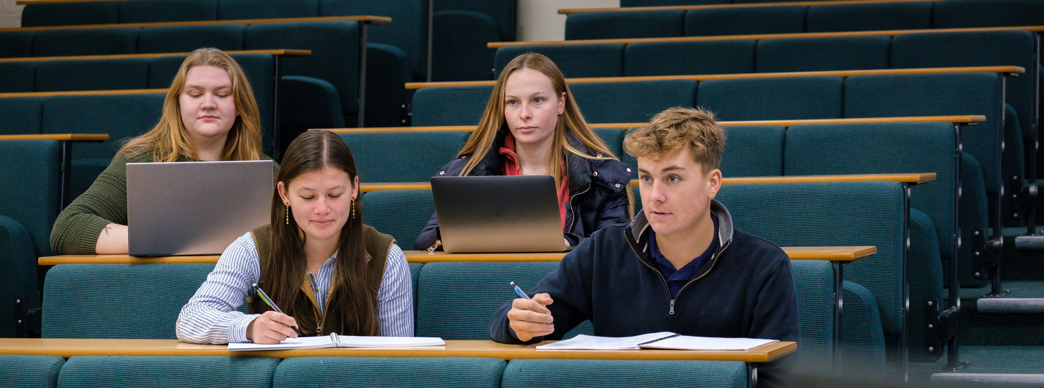 four students in a lecture theatre
