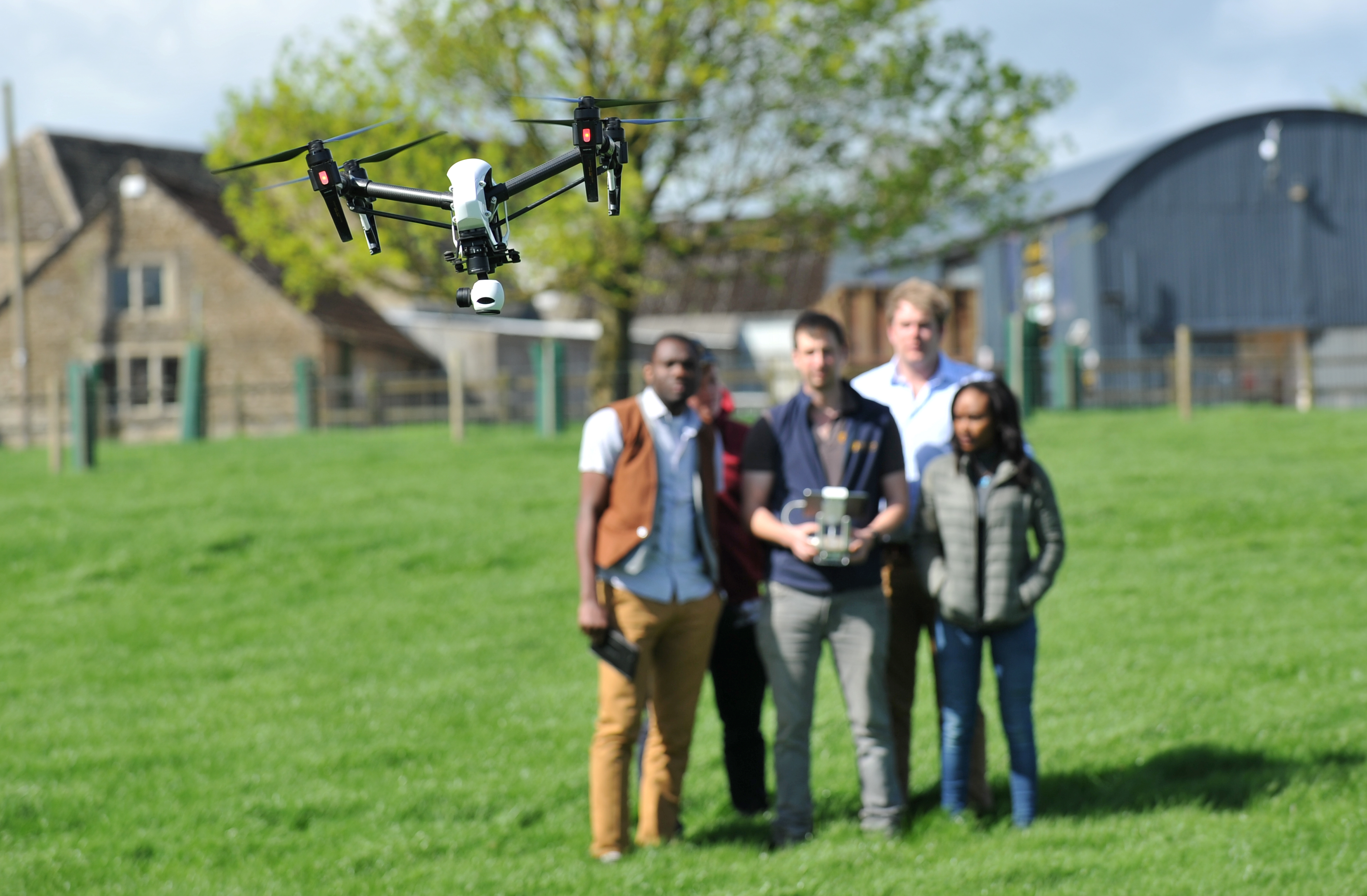 Drone workshop with students in a field