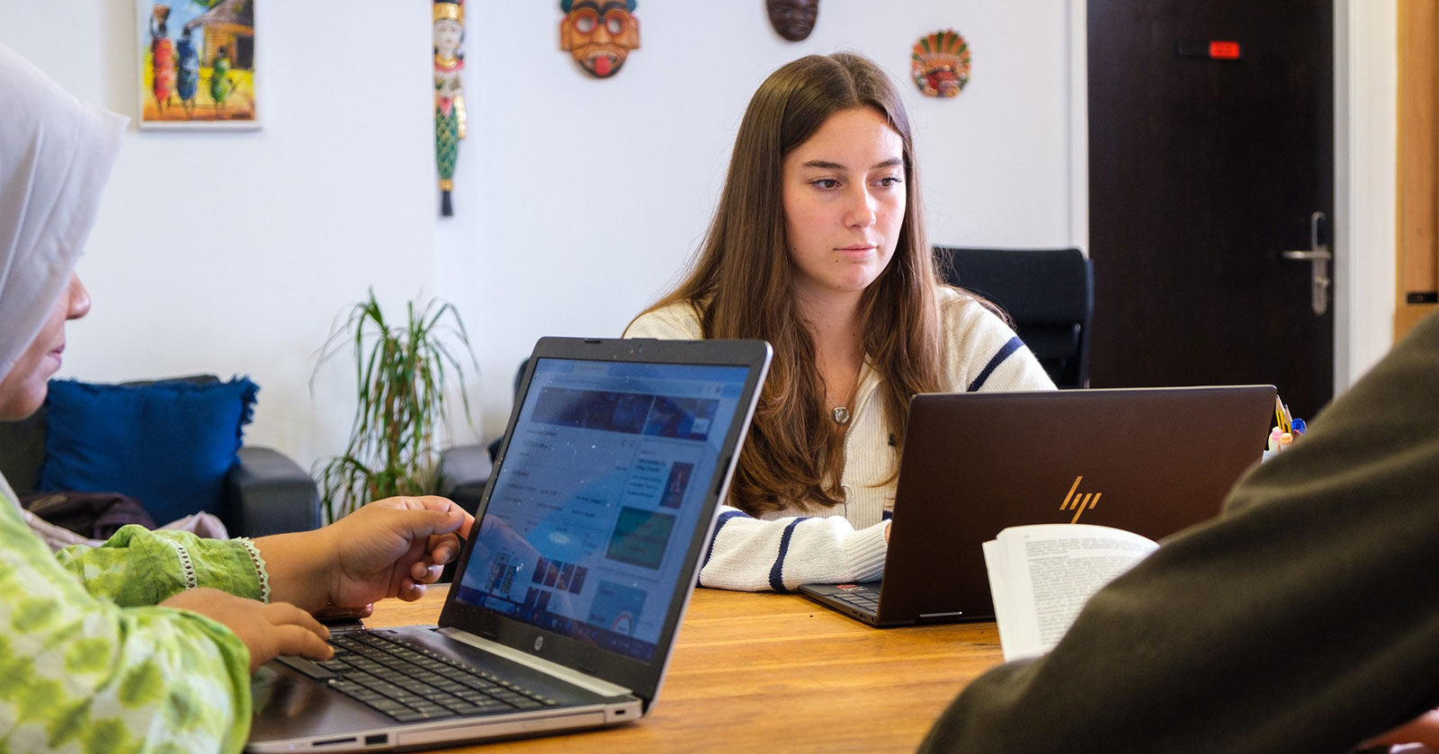 students looking at a laptop