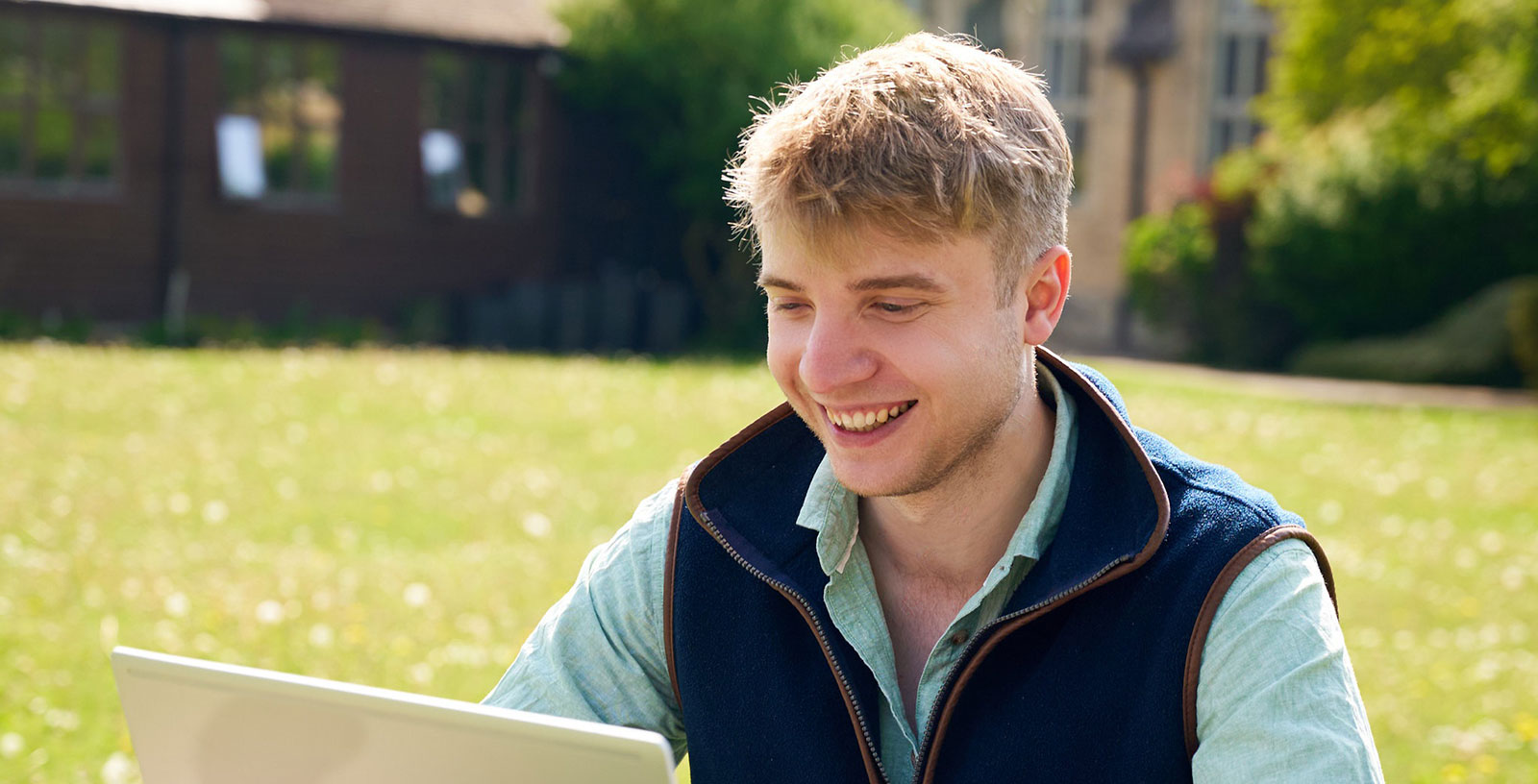 student looking at laptop