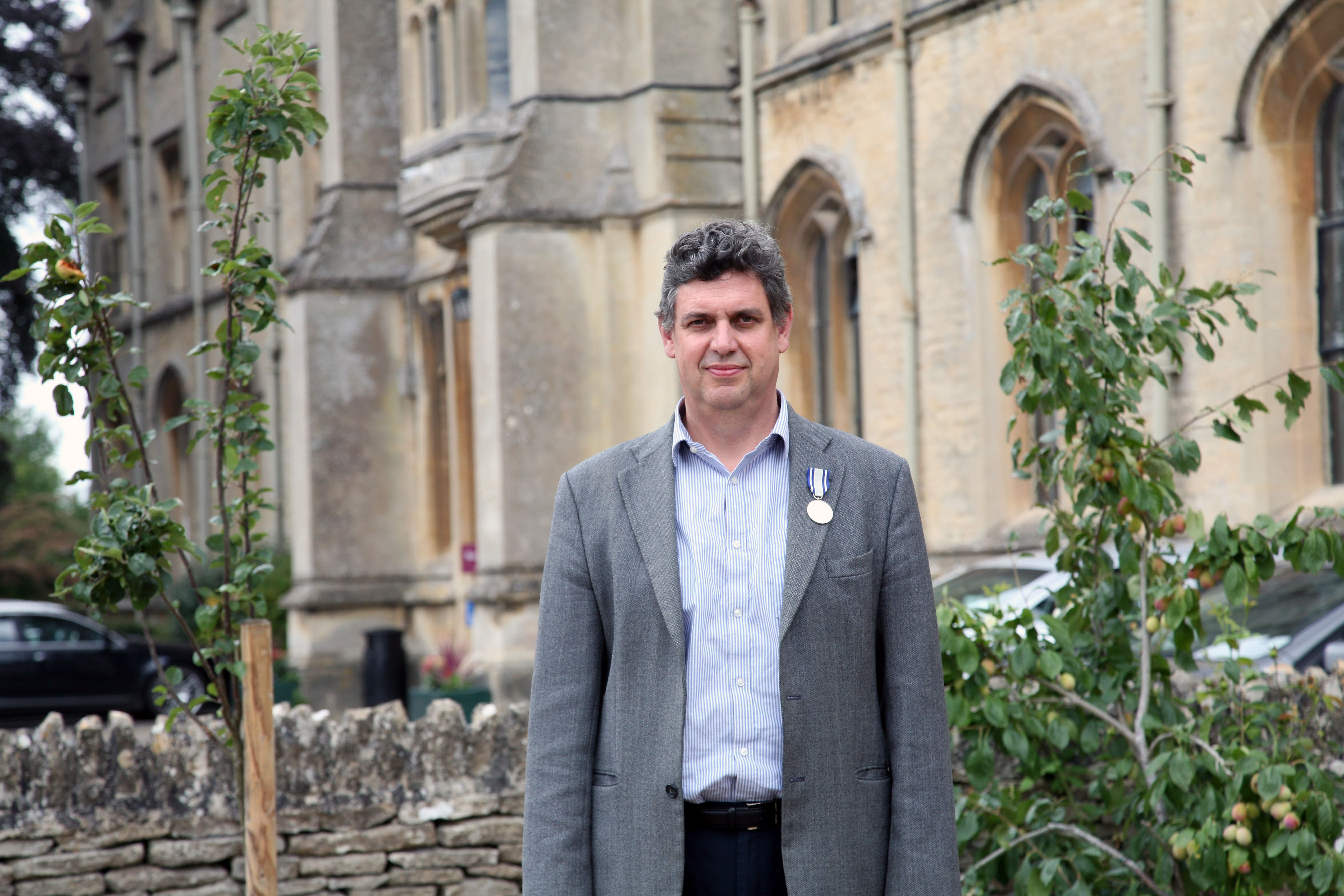 A photo of professor of animal health and welfare, who has worked as a trustee for RSPCA Assured for the last decade, has been awarded the charity’s prestigious Queen Victoria Silver Medal, outside the RAU Main Building.