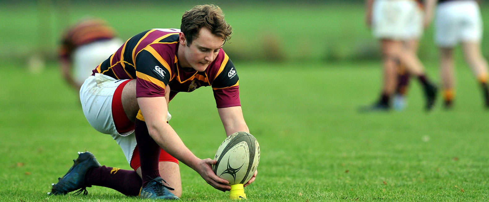 student about to kick a conversion in rugby