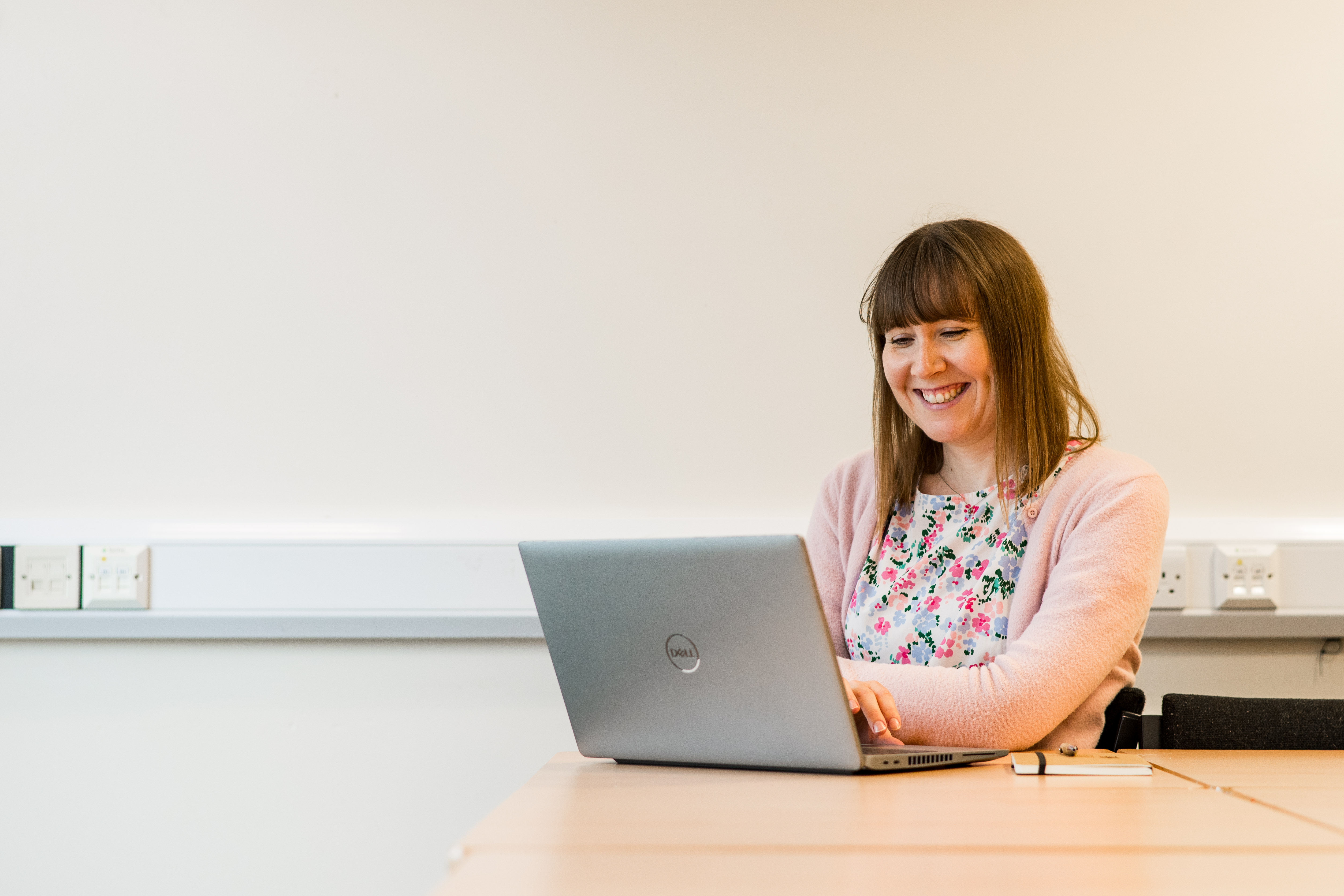 woman looking at a laptop