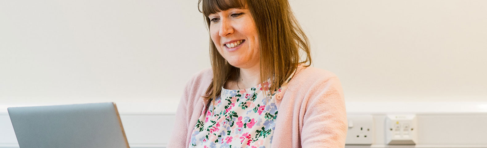 girl looking at laptop