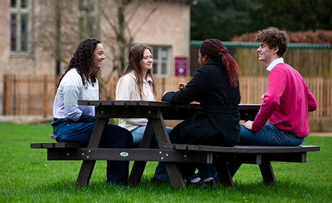 Students sat at a picnic table