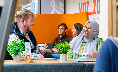 Students chatting in a cafe