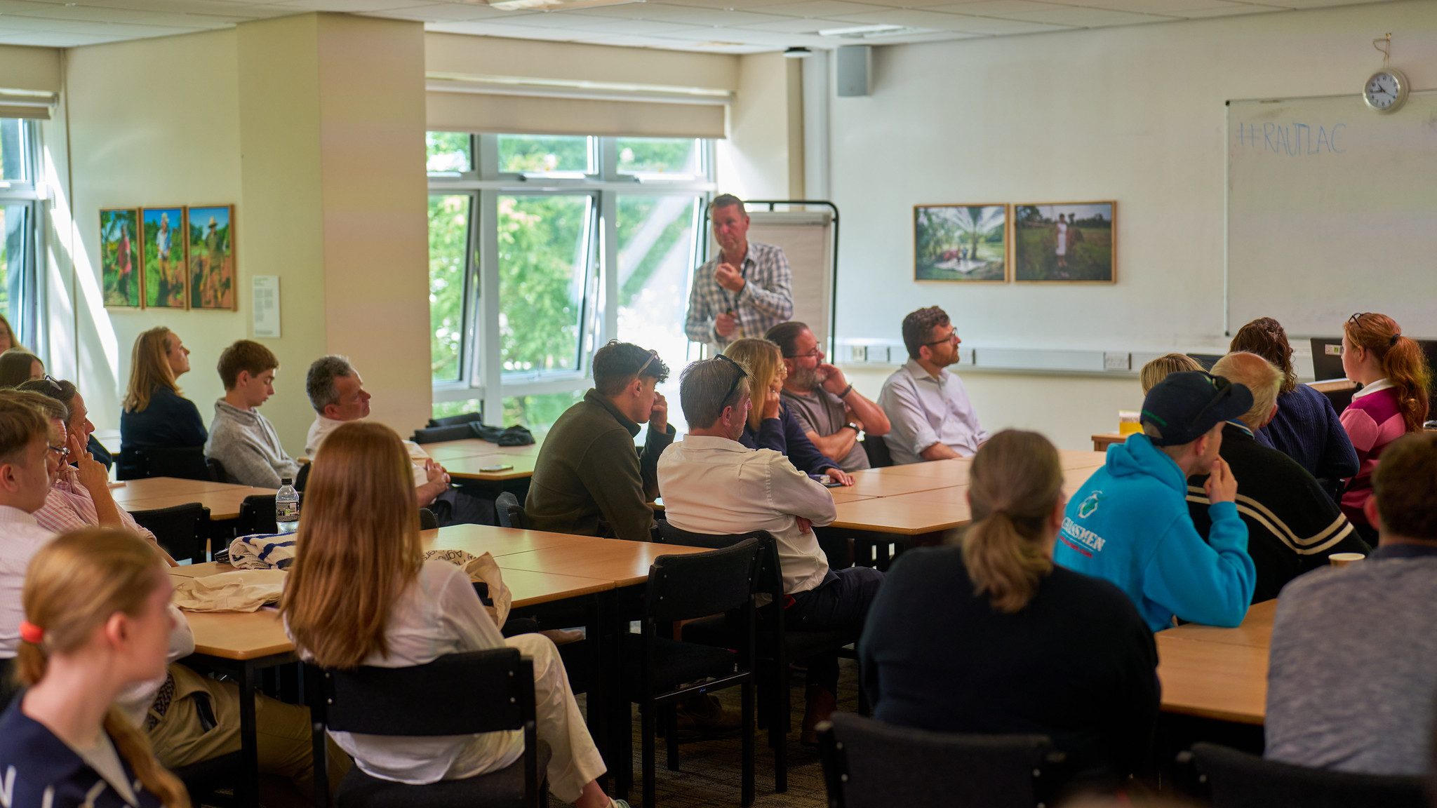 lecturer teaching students in classroom