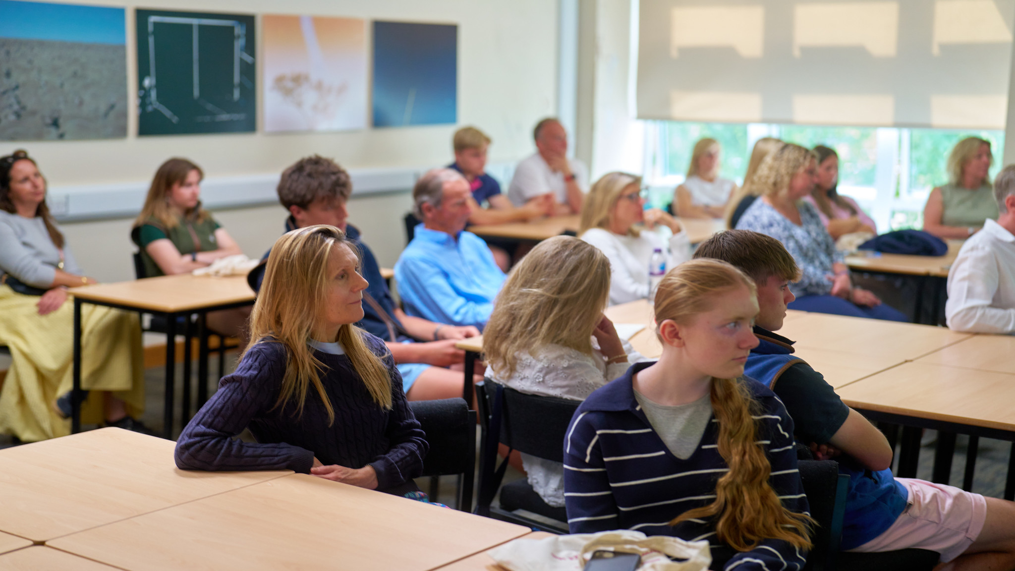 group of parents and children in a classroom
