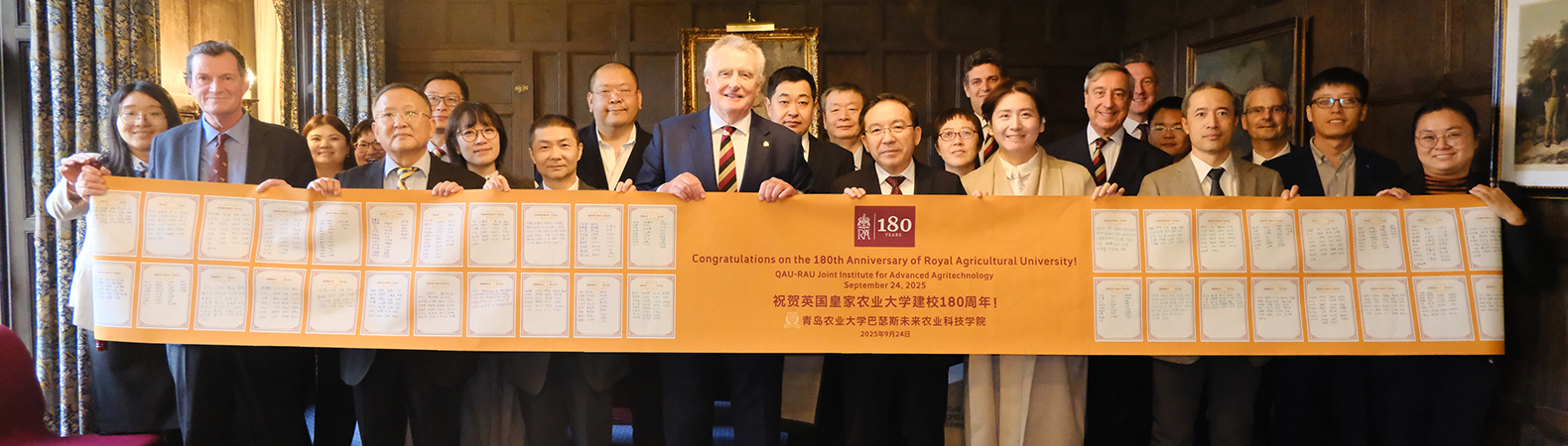 QAU visiting the RAU and gifting a congratulations banner