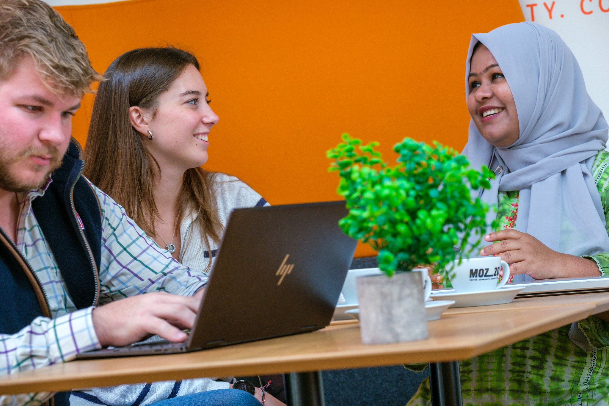 Three students chatting