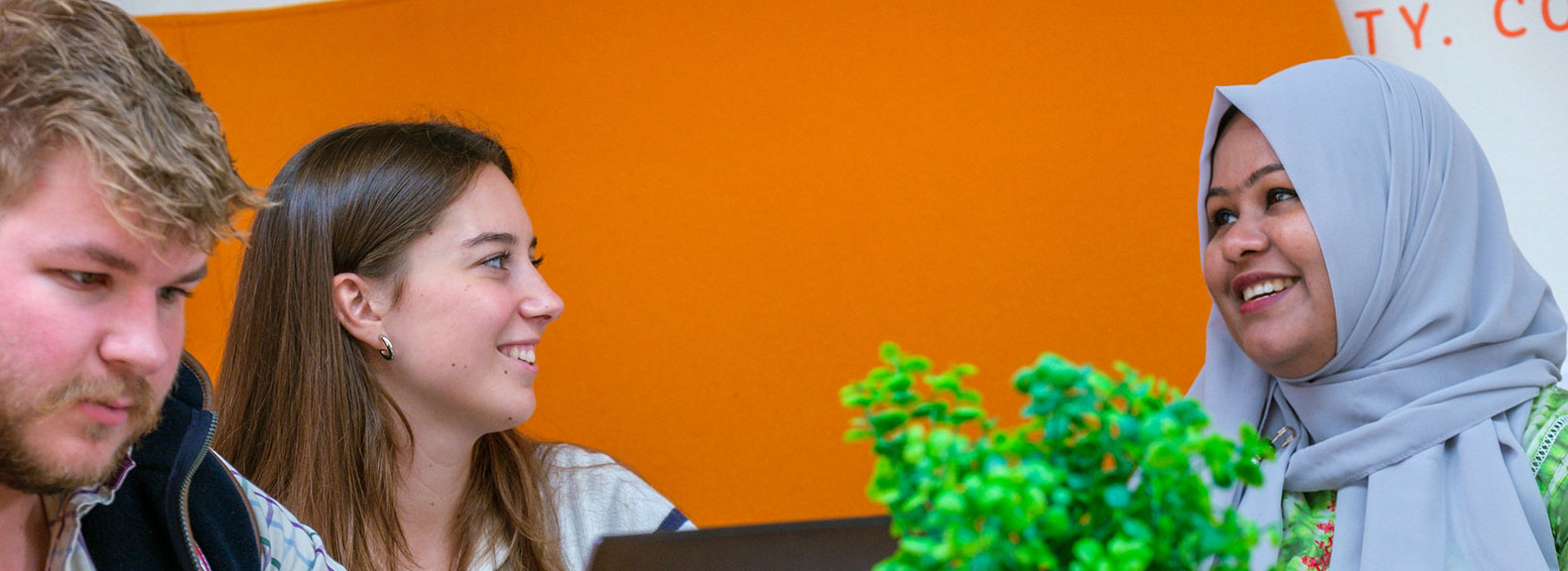 three students chatting