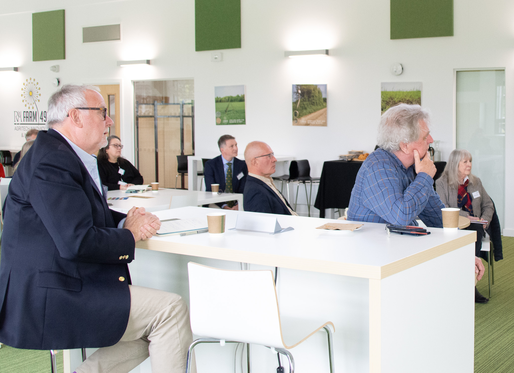 Seated delegates in a contemporary space