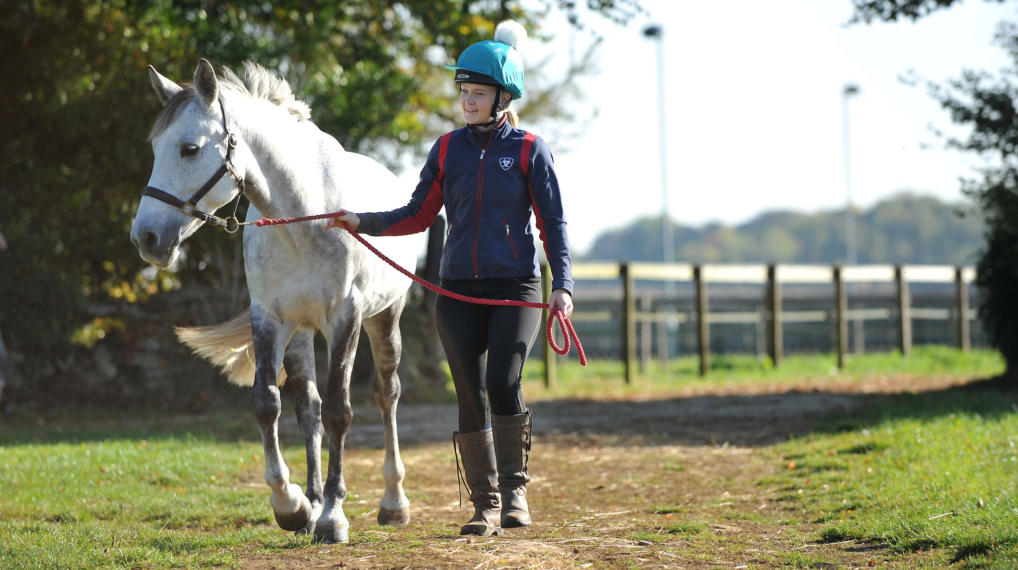 Student leading horse