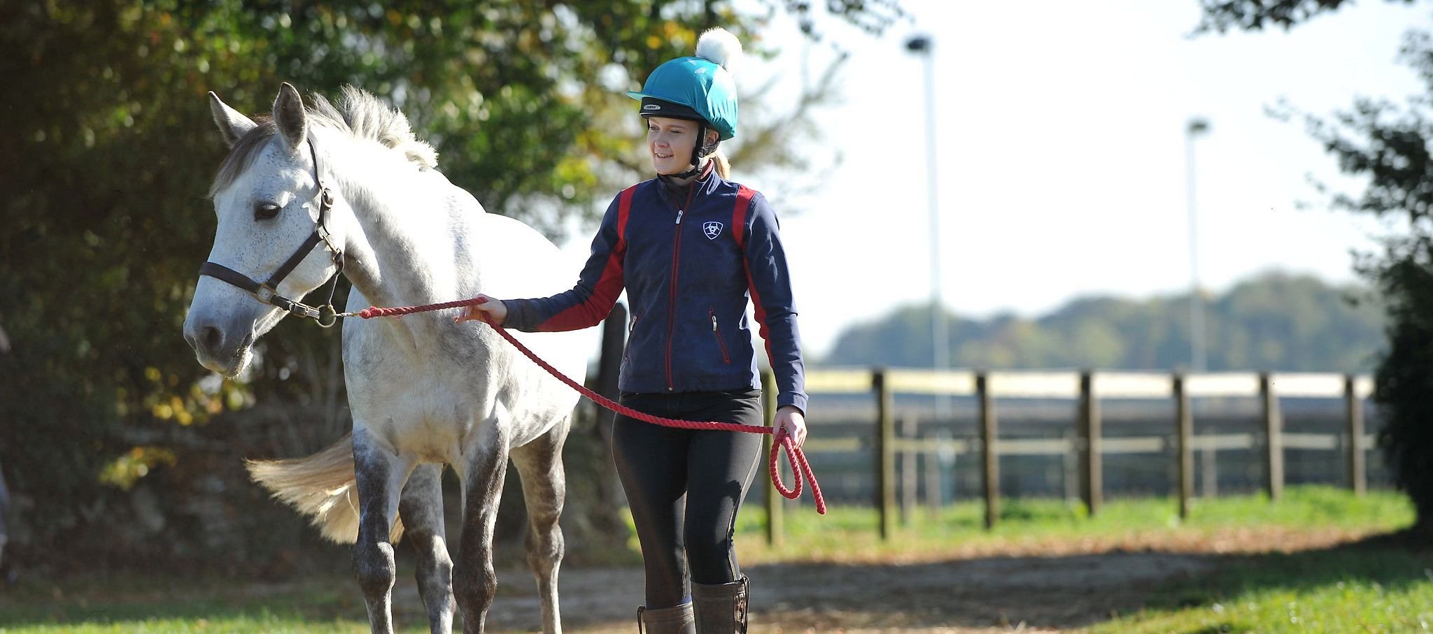 Student leading horse