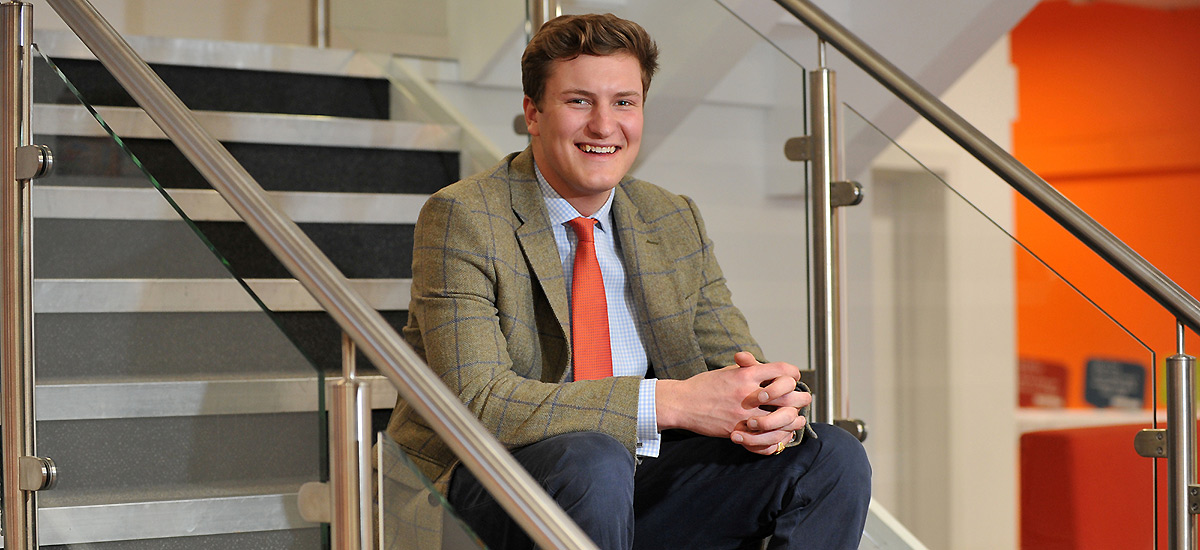 Student sitting on staircase