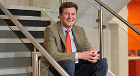 Student sitting on staircase