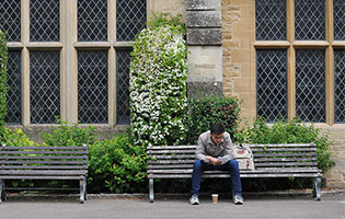 Student sat on bench
