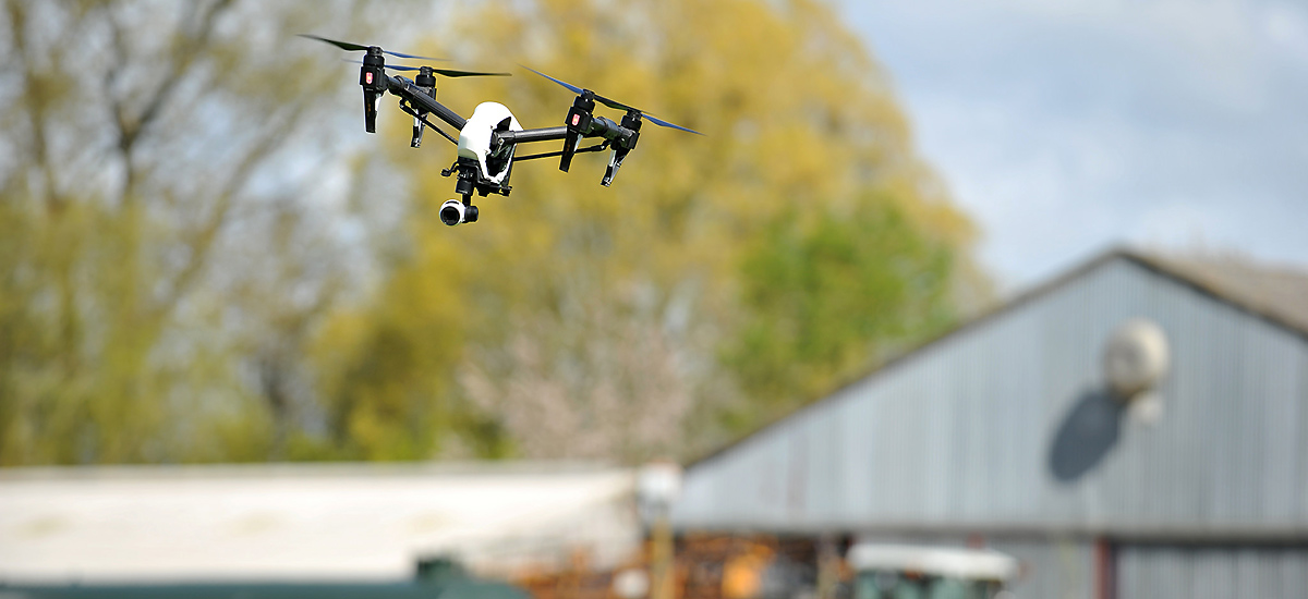 Image showing a drone flying over a farm