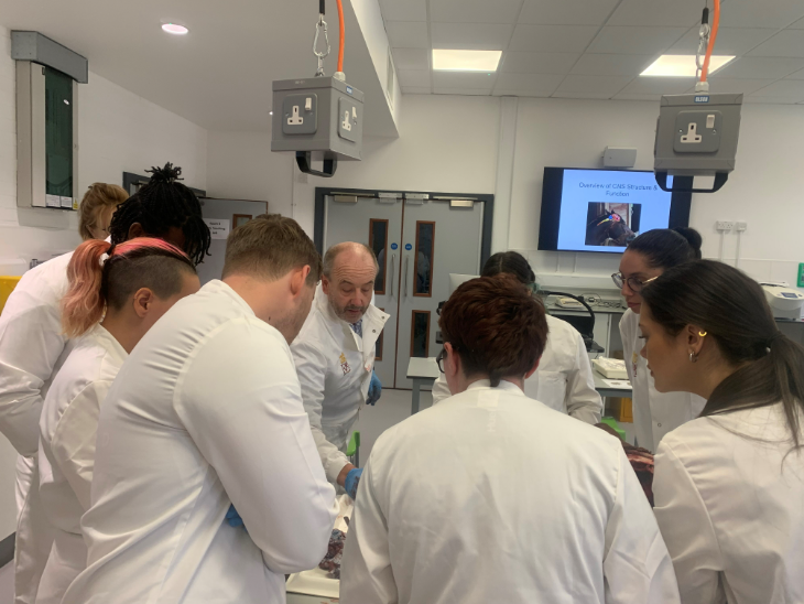 Delegates in the laboratories observing a dissection