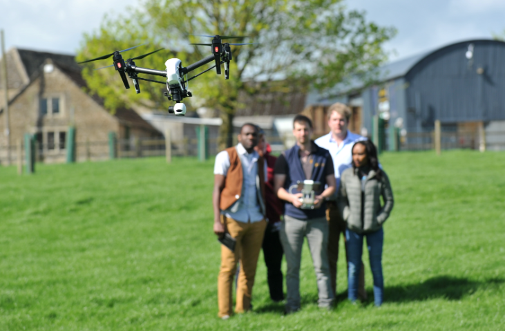 Drone workshop with students in a field