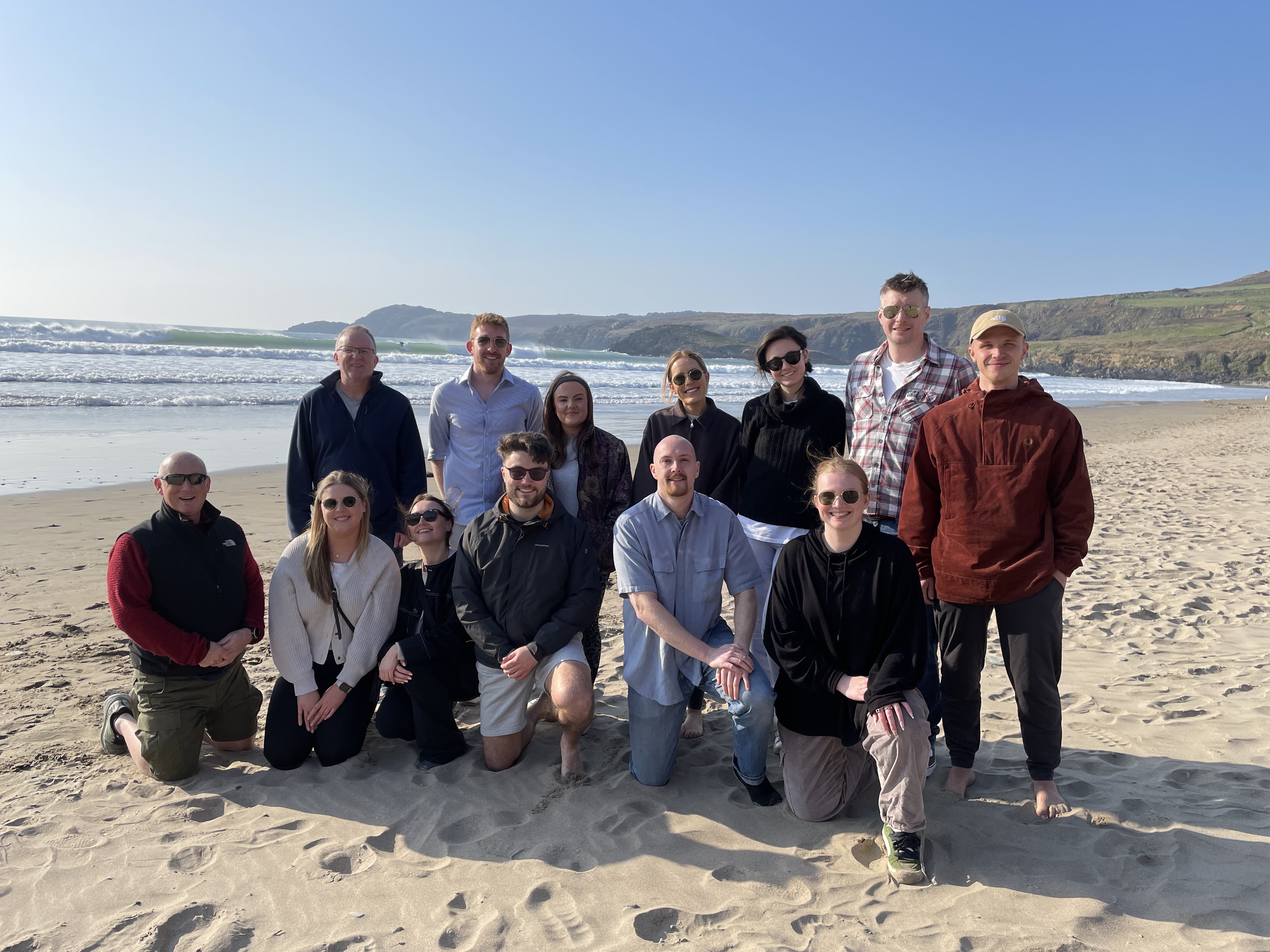 Future leaders delegates standing for group photo on the beach at their residential