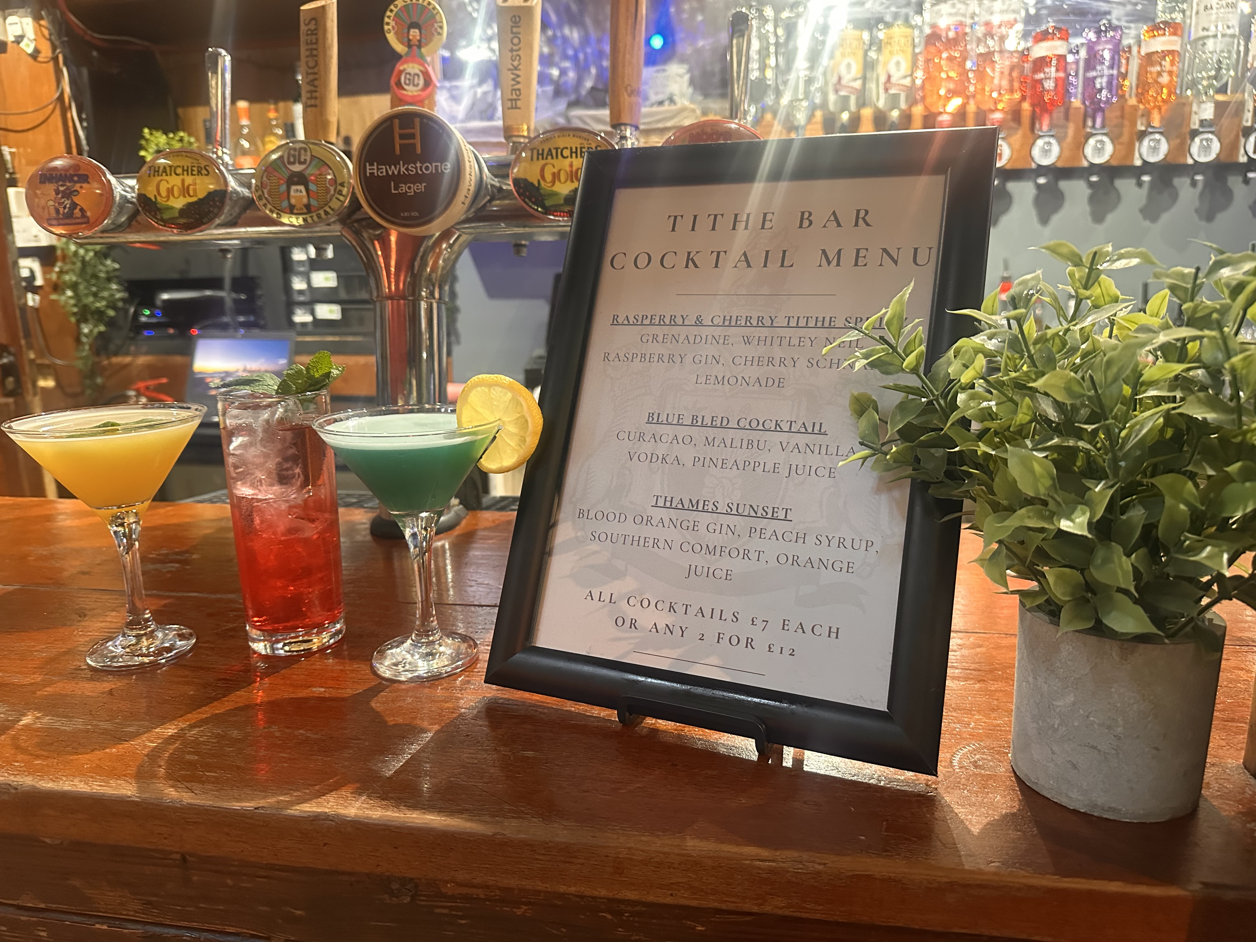 cocktail menu on a bar