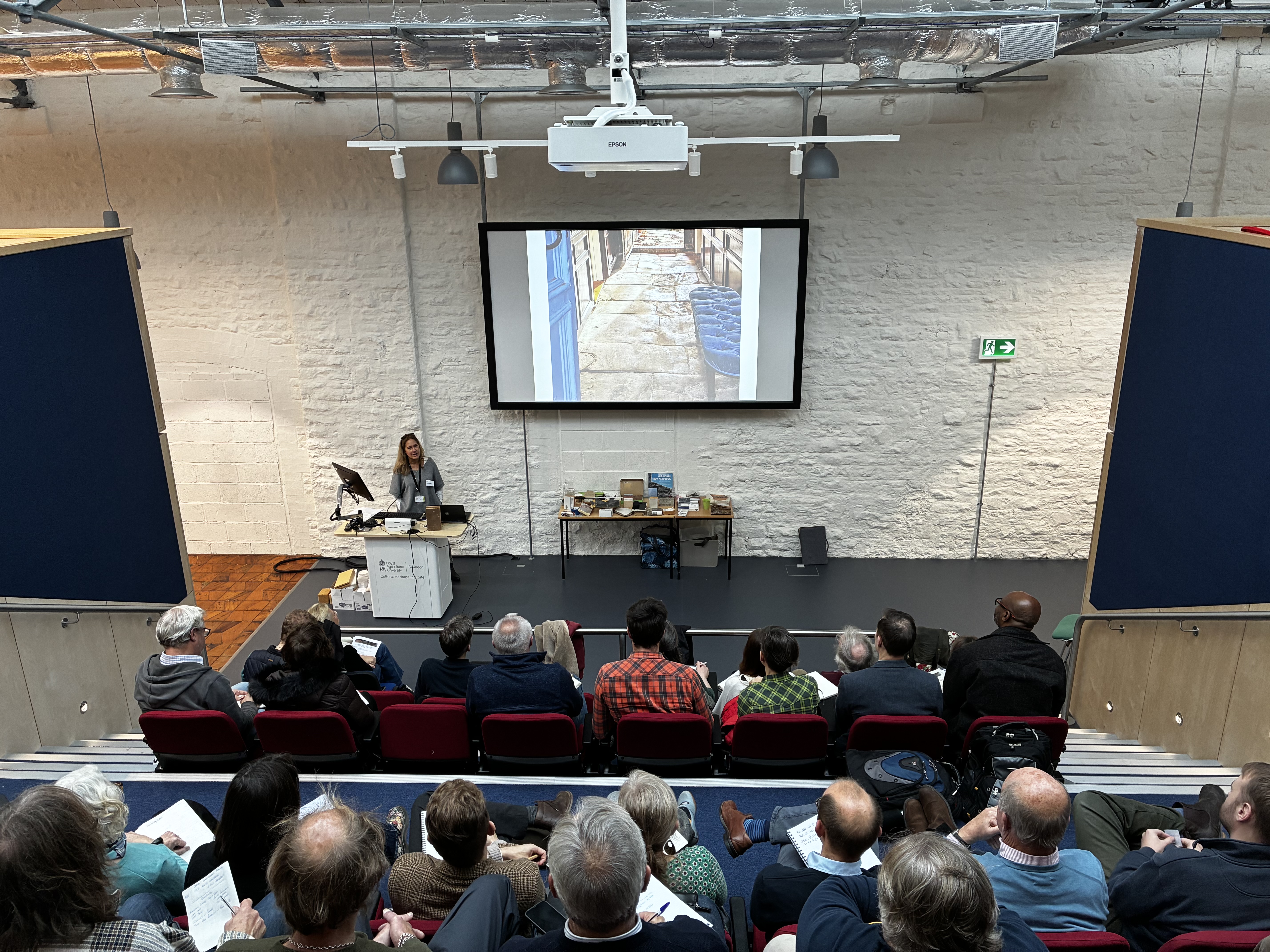 Photo of a presenter in front of an audience