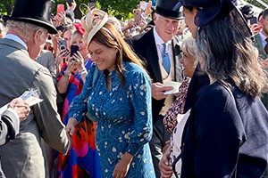 Katy Duke shaking hands with HM King Charles III