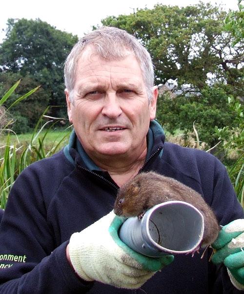 Prof Alastair Driver holding a vole