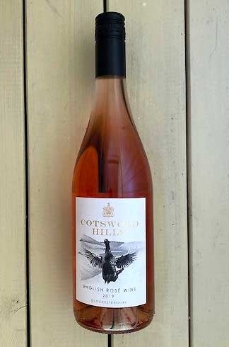 Image of Rose wine bottle, showing artwork of black and white goose about to take off