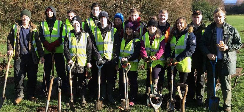 Group photo of students planting trees for Tree Week 2018