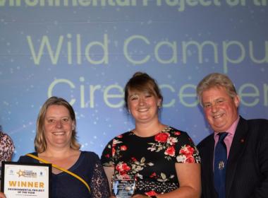 RAU staff collecting environmental project of the year award