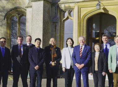 Delegation from Shenyang University standing in front of entrance