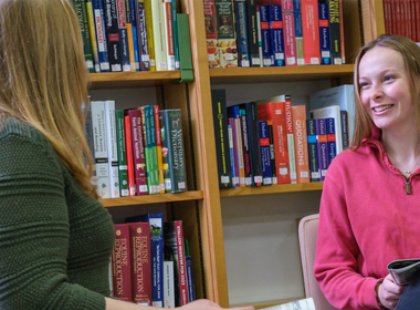Two students in a library