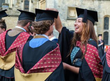Students at graduation with gowns and hats