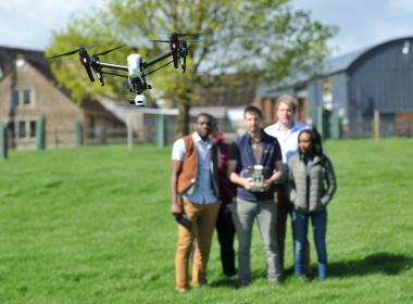 Drone workshop with students in a field